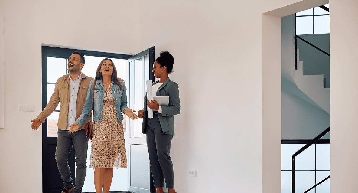 A group of people standing in front of a door.