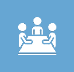 A group of people sitting at a table.